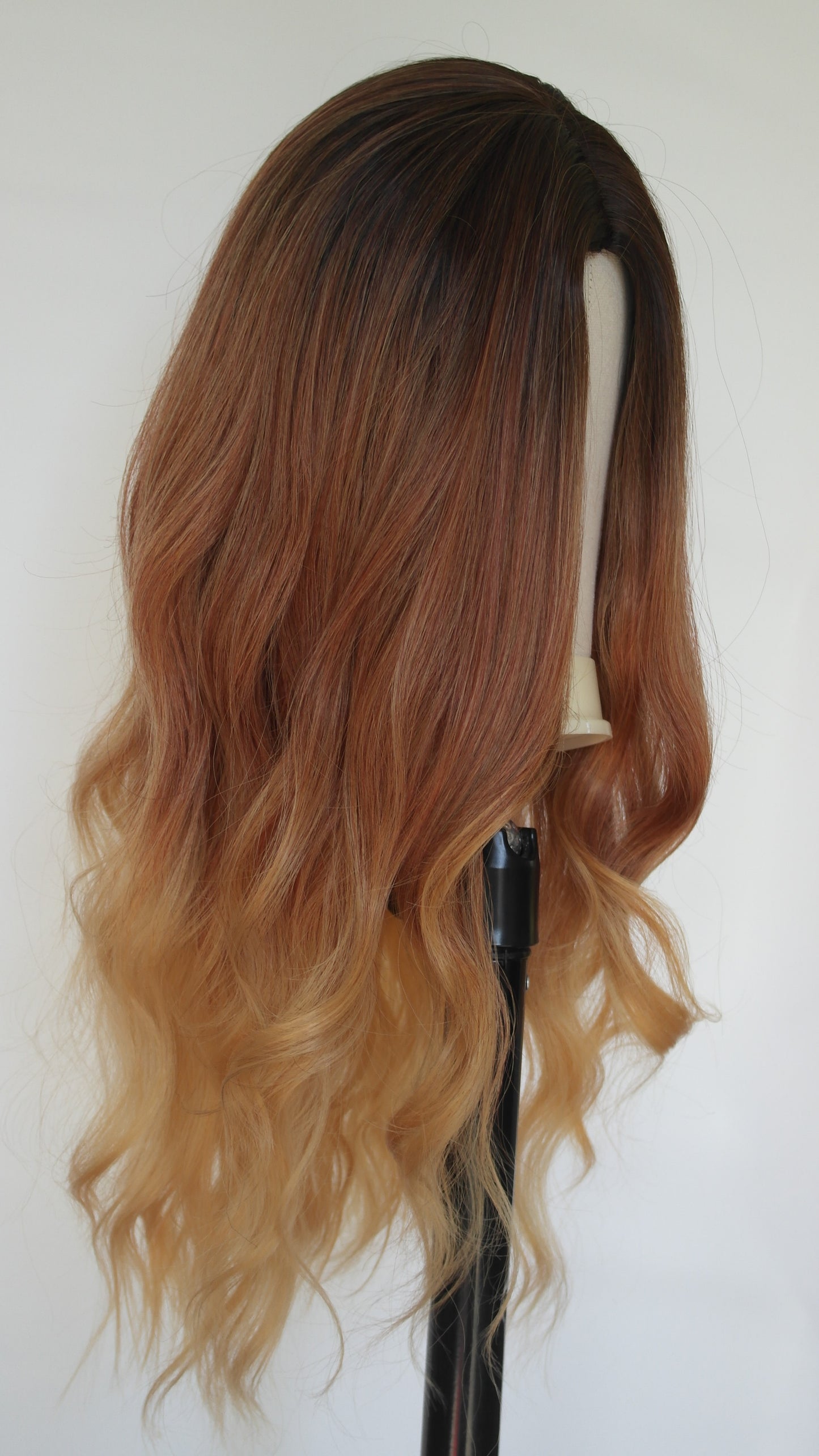 The soft copper color features delicate warm, reddish-gold undertones, creating a subtle yet captivating ginger hue that looks incredibly natural. Auckland wig shop. Afterpay available