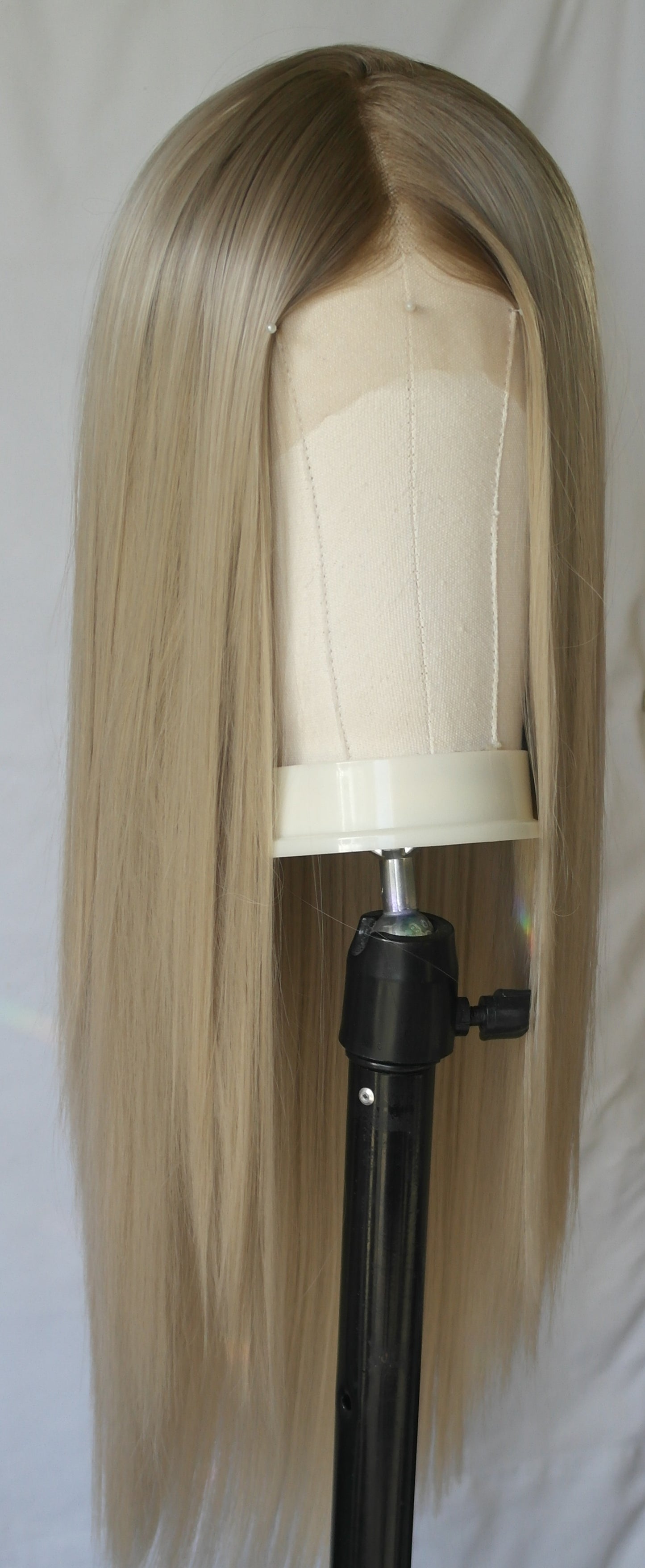 Luxurious creamy blonde wig with subtle beige undertones, reminiscent of a rich vanilla shade.